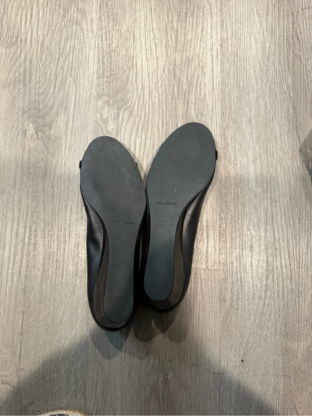 Cole Haan Black Leather Round-Toe Ballet Wedge Heels with Gold Logo Accent